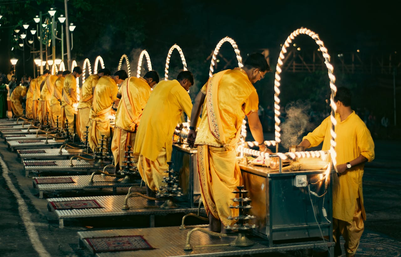gallery-6 Group of men performing a traditional Hindu ritual ceremony outdoors at night.